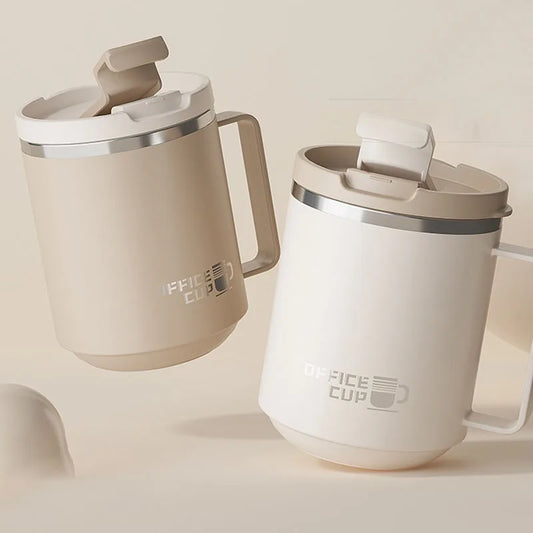 Double-wall stainless steel coffee mug with ergonomic handle in grey